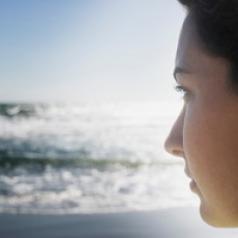 Woman looking over ocean